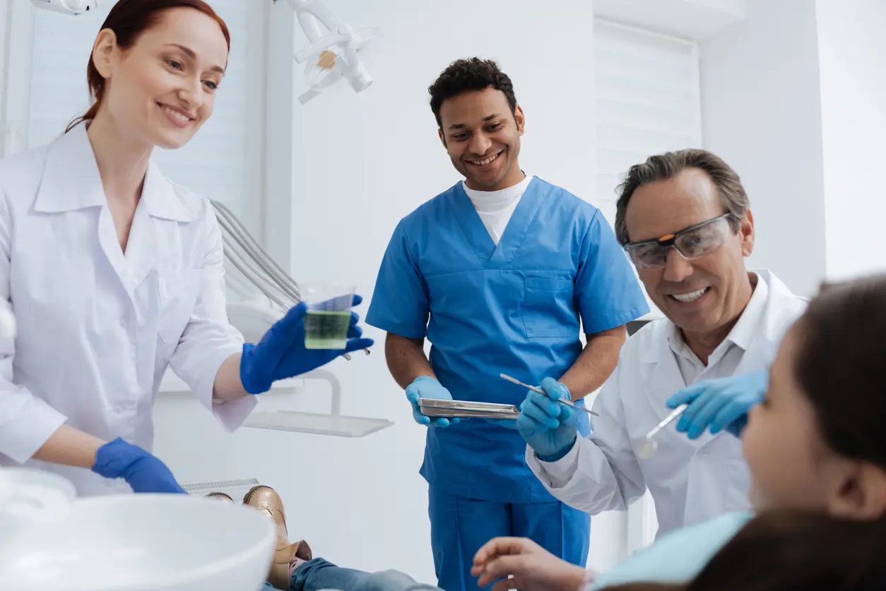 Dental professionals treating a patient