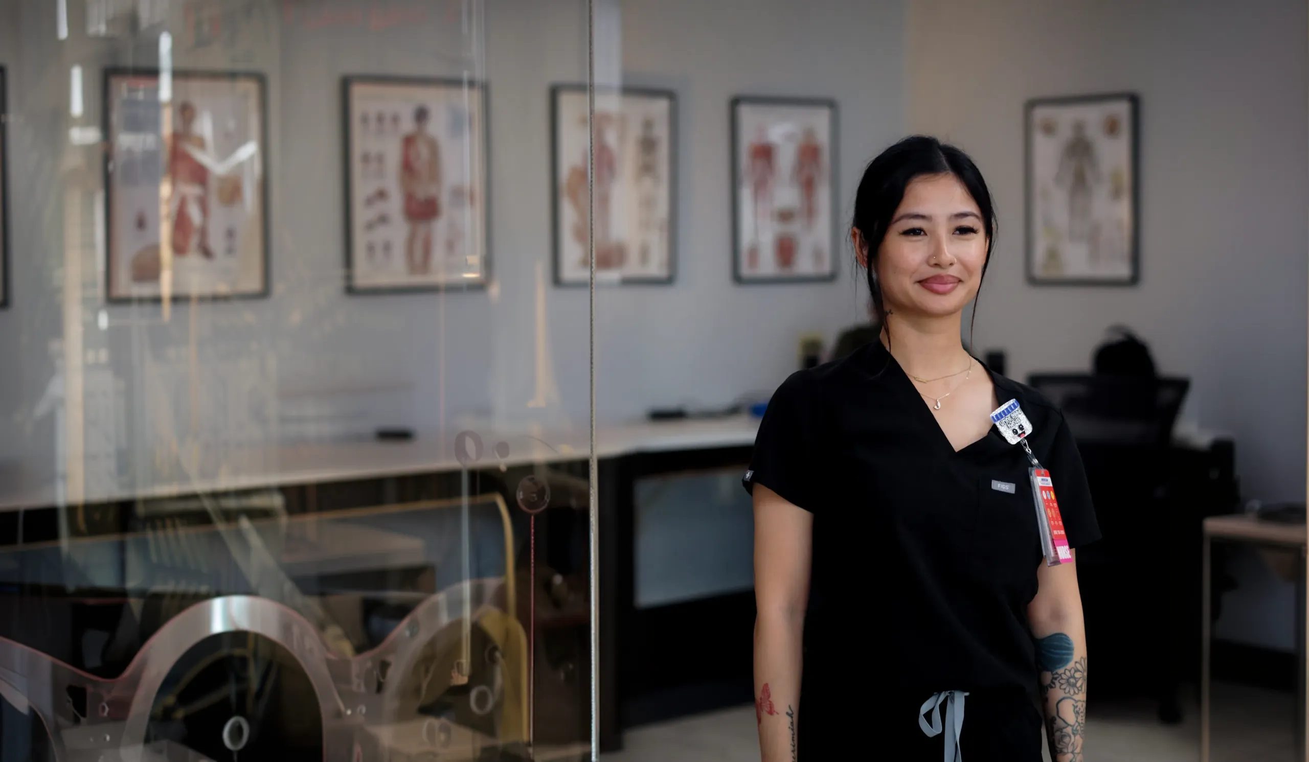 Healthcare professional in scrubs at a medical facility